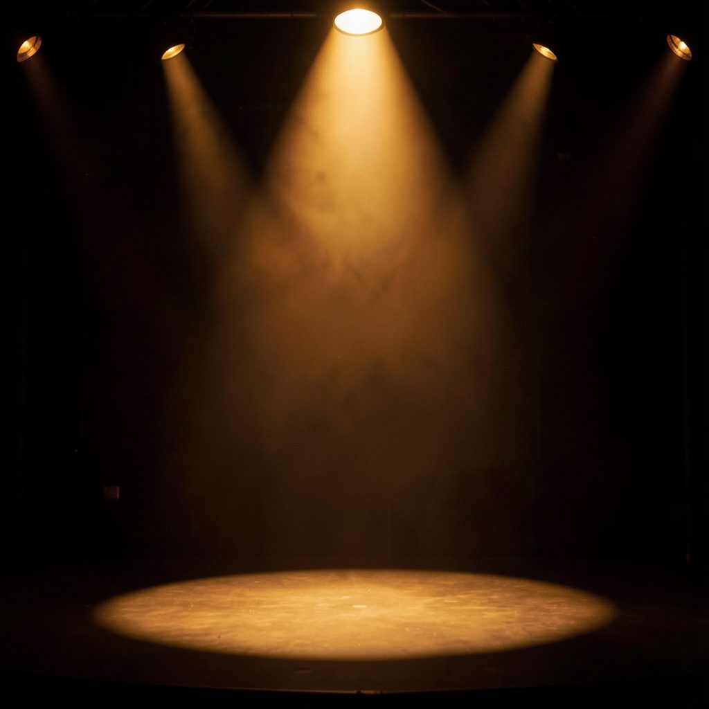 Glamorous stage lighting casting warm amber and deep shadow across an empty spotlight, cinematic and aspirational mood
